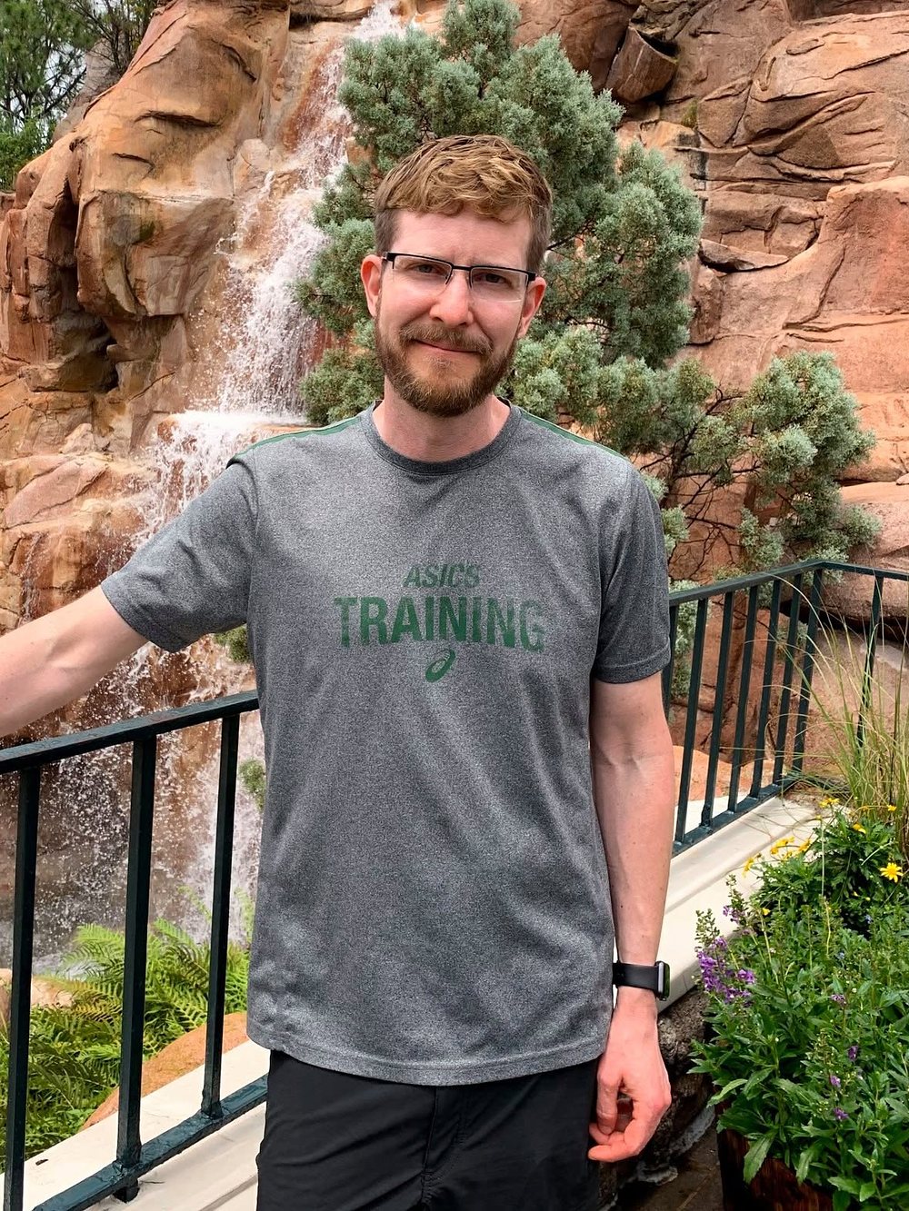 Kurt Zoglmann standing in front of a waterfall